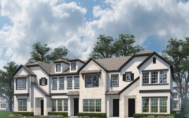a large house with trees in the back